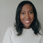 Headshot of a smiling woman with a calm expression.
